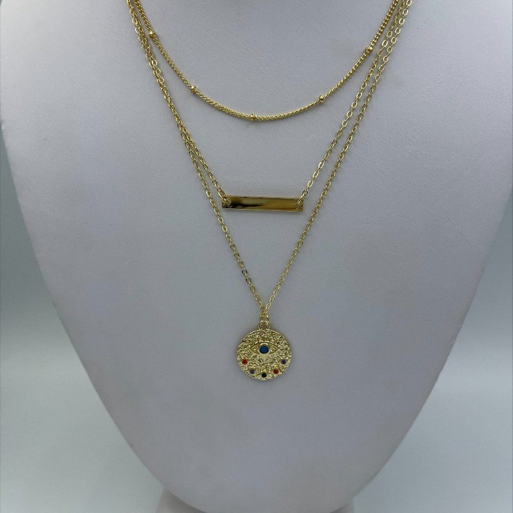 New 3 tiered chain necklace with medallion, good luck eye, bar charm, gold tones
